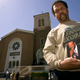 In April 2005, a man stands outside Second Baptist Church where the funeral for Johnnie Cochran Jr. took place